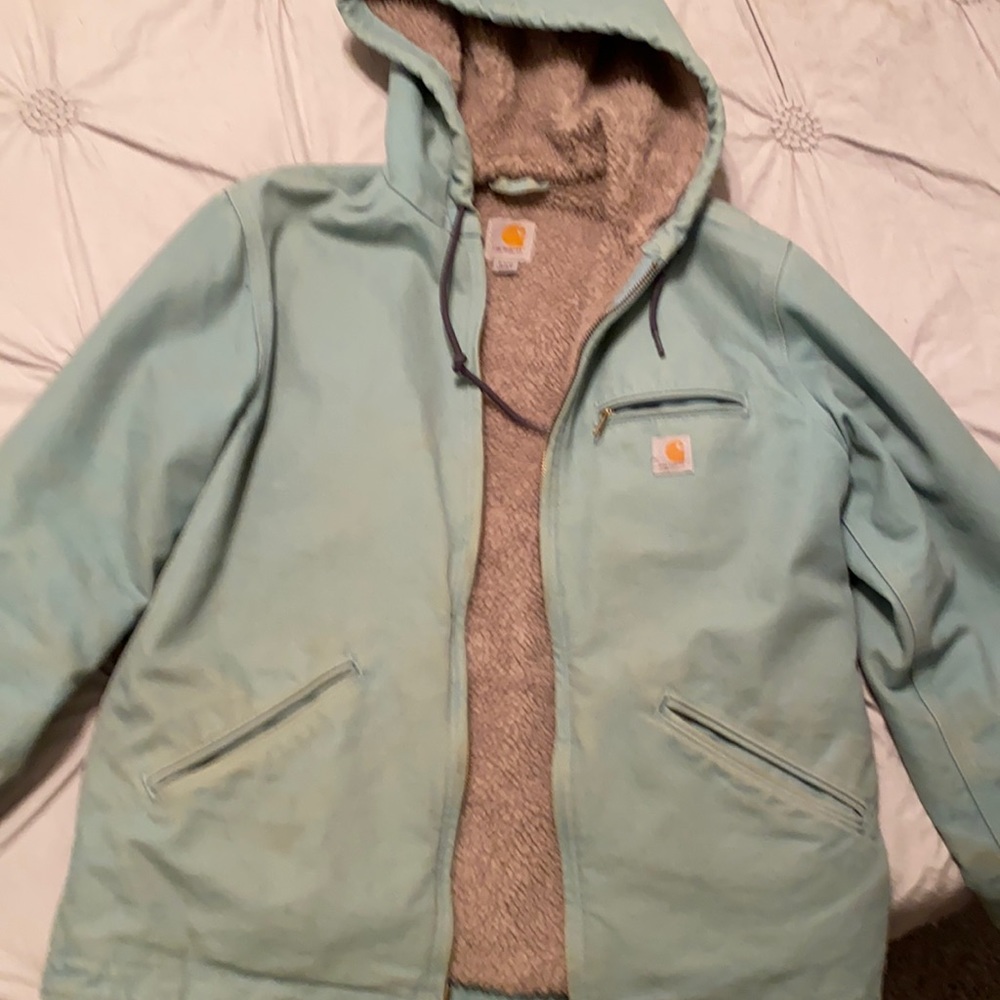 Women’s carhartt jacket. Has some fading like all carhartt a do.